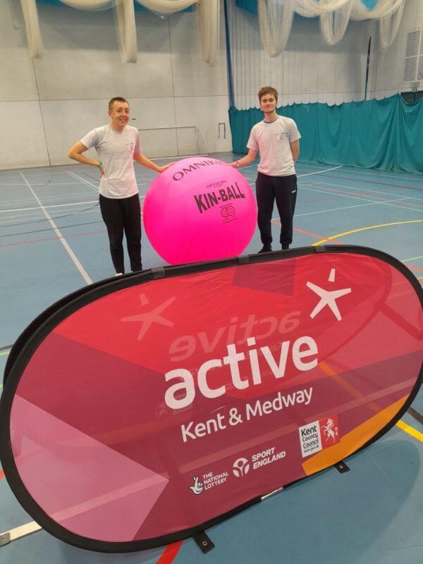 KS4 sports coaches with a bright pink Kin-Ball