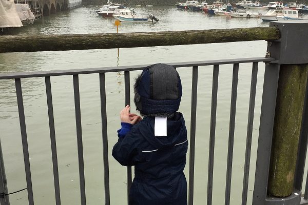 Year R pupil looking at different boats